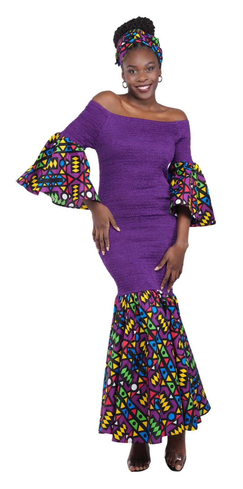 Woman in a Long Smoked Fish Tail Dress with head wrap in vibrant colors, showcasing theresa exotic fashion style.